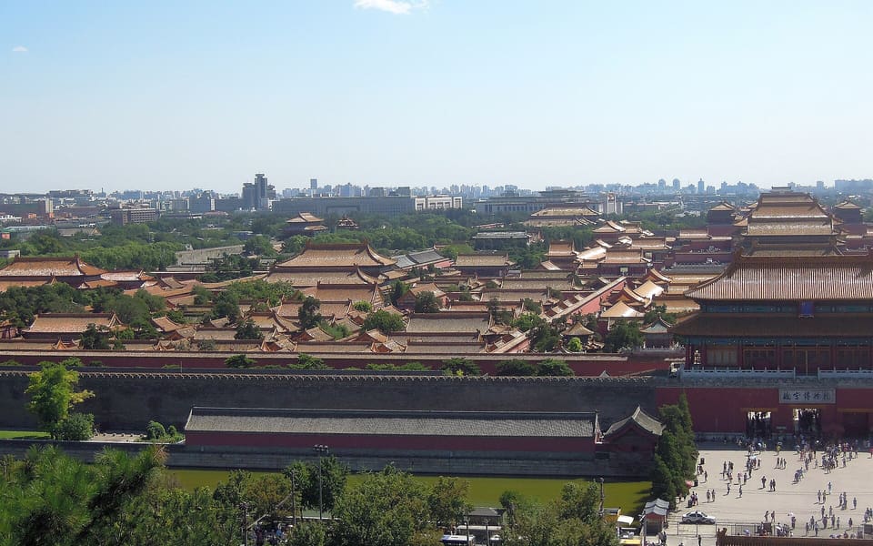 Rows of golden-roofed halls and courtyards stretch through Beijing's Forbidden City beneath Jingshan