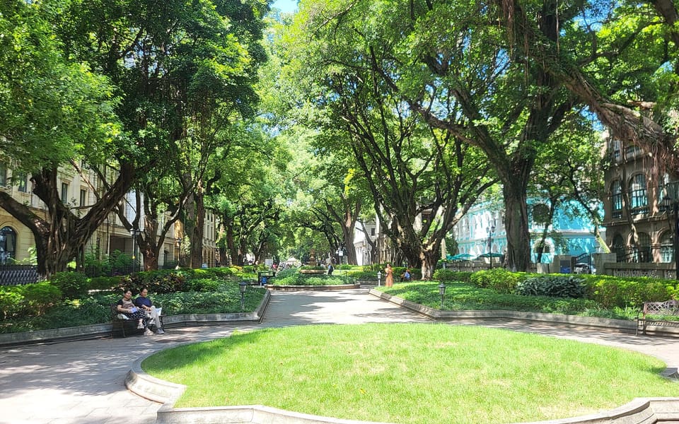Tree-shaded pedestrian avenue lined with historic buildings on Shamian Island in Guangzhou