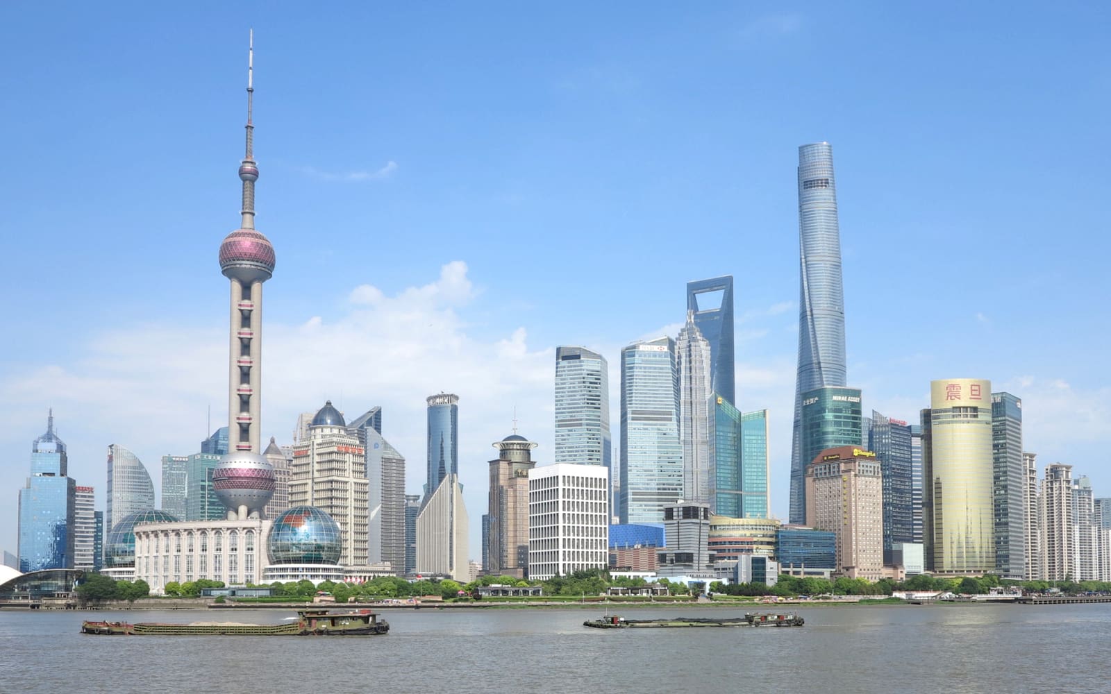 Pudong skyline across the Huangpu River, with the Oriental Pearl Tower and Shanghai Tower